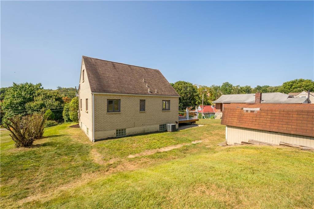 215 Pinchtown Road Pittsburgh, PA 15236 - Photo 24 of 31 a view of a house with a yard