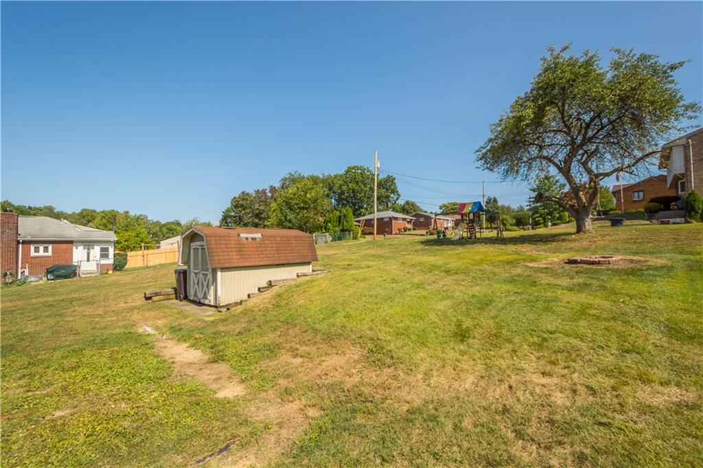 215 Pinchtown Road Pittsburgh, PA 15236 - Photo 27 of 31 a backyard of a house with table and chairs