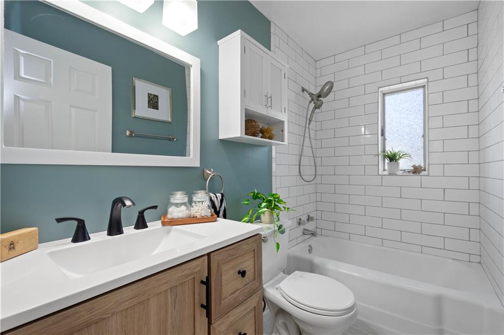 215 Pinchtown Road Pittsburgh, PA 15236 - Photo 8 of 31 a bathroom with a sink a toilet and shower