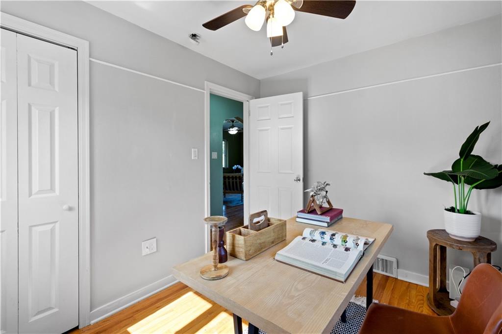 215 Pinchtown Road Pittsburgh, PA 15236 - Photo 10 of 31 a view of a workspace with furniture and a potted plant