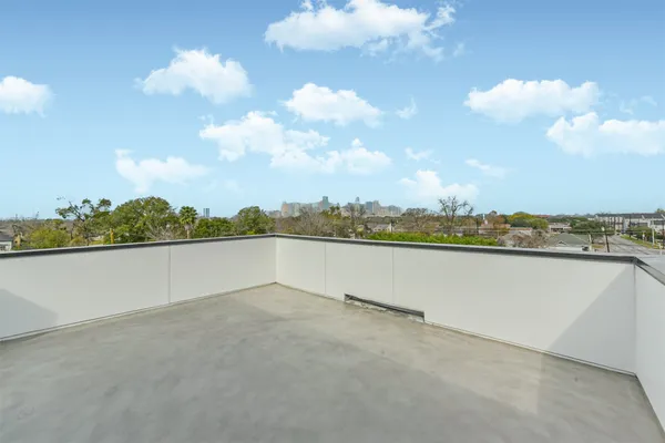 a terrace view with seating space barbeque oven and a stove