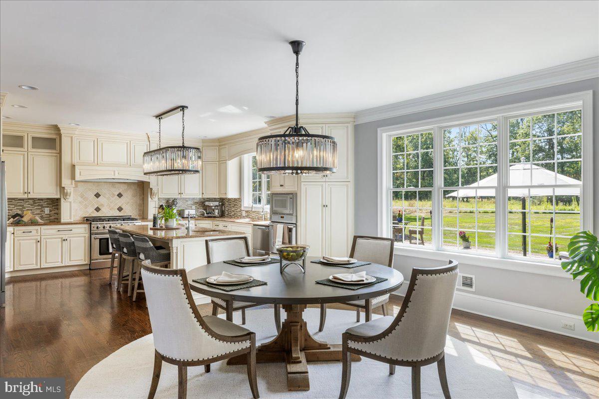 29 Tumble Falls Road Stockton, NJ 08559 - Photo 11 of 78 a dining room with furniture a chandelier and wooden floor