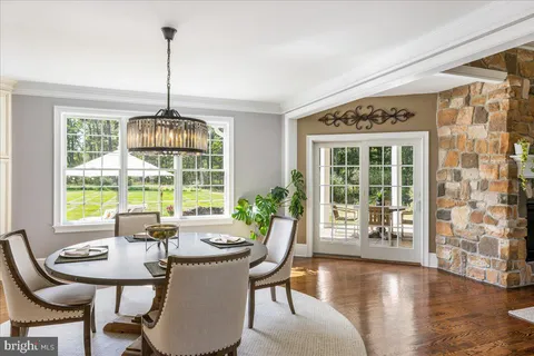 a kitchen with granite countertop a sink stove and cabinets