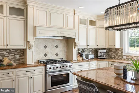 a kitchen with a refrigerator and cabinets