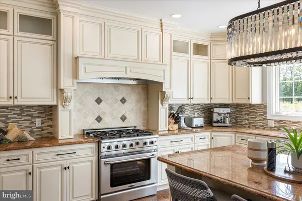a kitchen with a refrigerator and cabinets