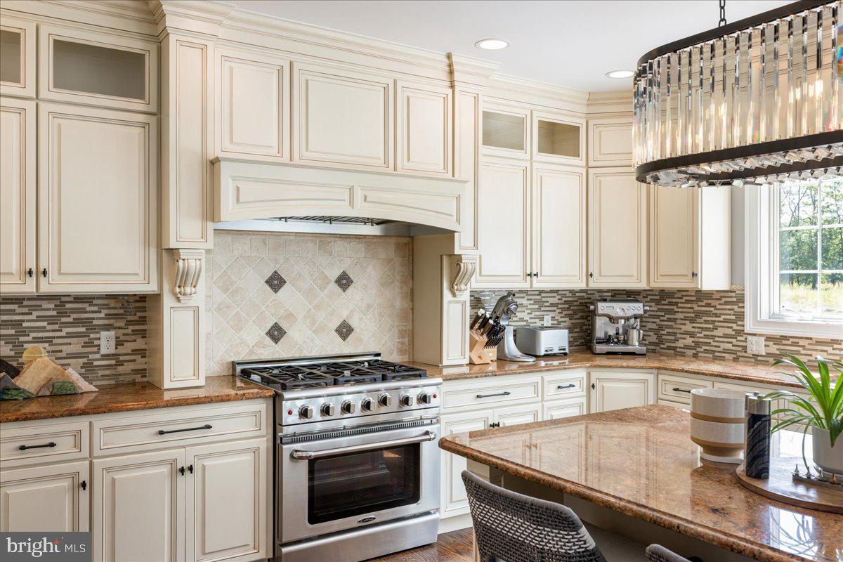 29 Tumble Falls Road Stockton, NJ 08559 - Photo 15 of 78 a kitchen with granite countertop a sink stove and cabinets