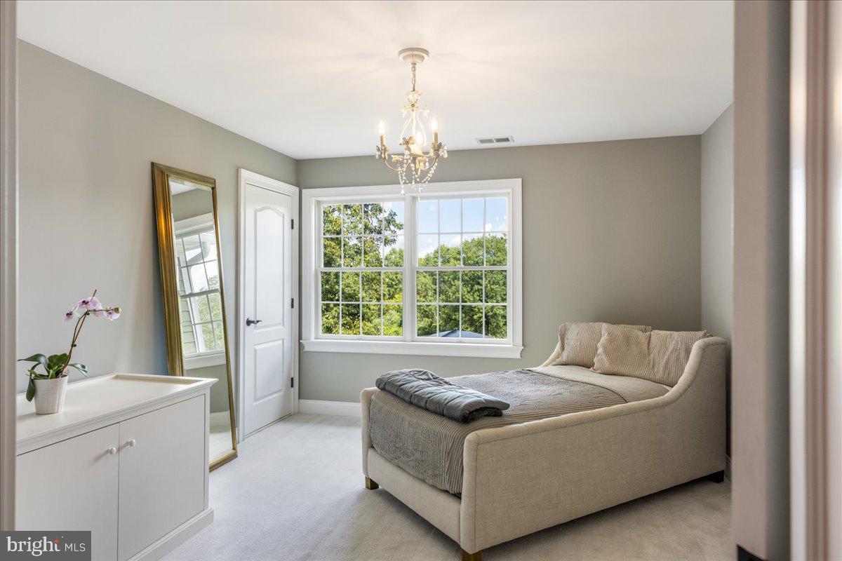 29 Tumble Falls Road Stockton, NJ 08559 - Photo 23 of 78 a living room with furniture and a chandelier