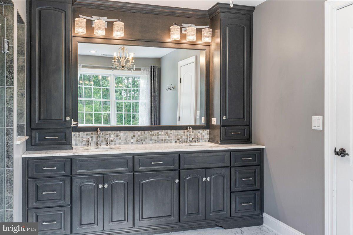 29 Tumble Falls Road Stockton, NJ 08559 - Photo 36 of 78 a bathroom with a sink and a mirror