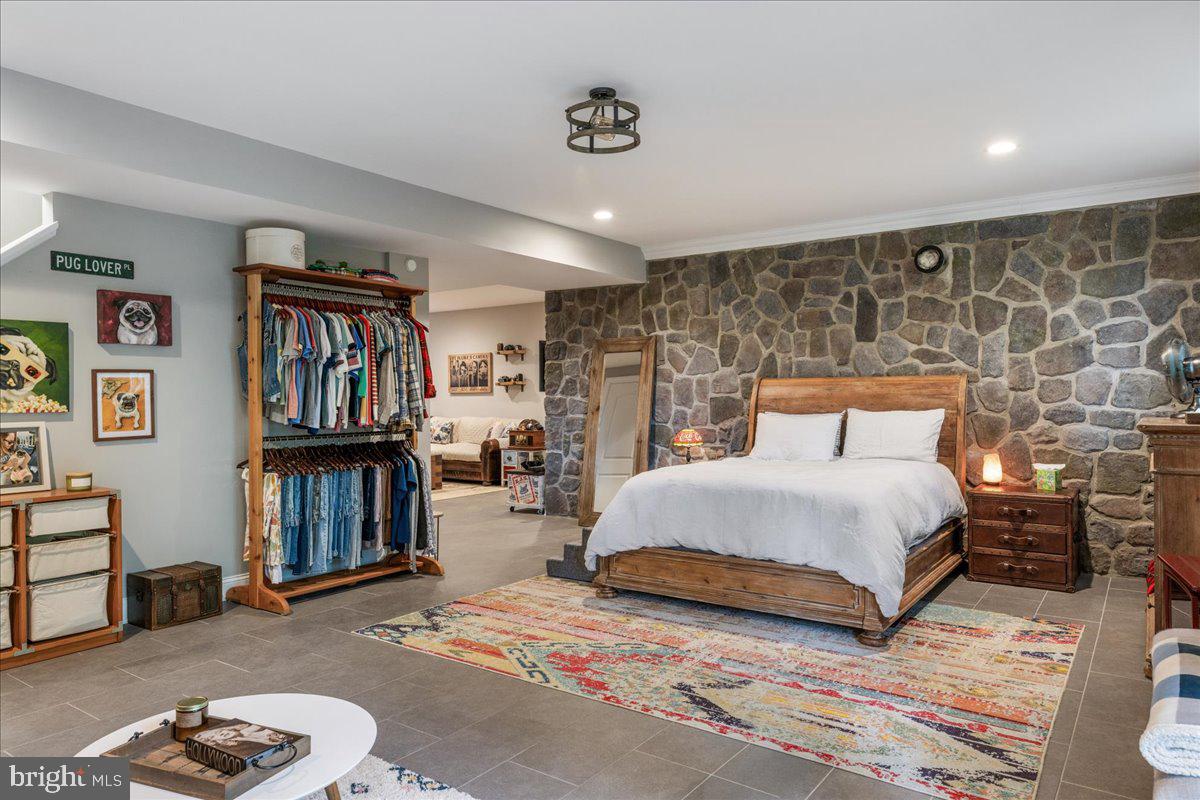 29 Tumble Falls Road Stockton, NJ 08559 - Photo 39 of 78 a bedroom with a large bed and a book shelf