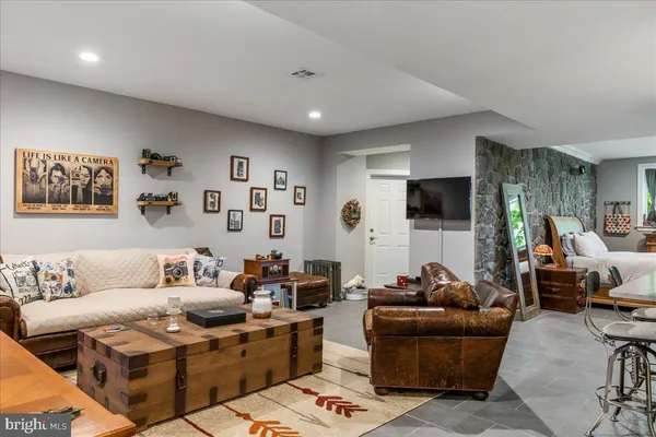 a view of a livingroom with wooden floor and a window