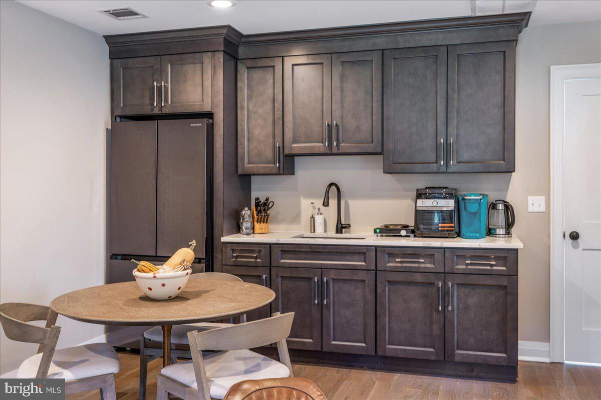 29 Tumble Falls Road Stockton, NJ 08559 - Photo 59 of 78 a kitchen with a sink cabinets and wooden floor