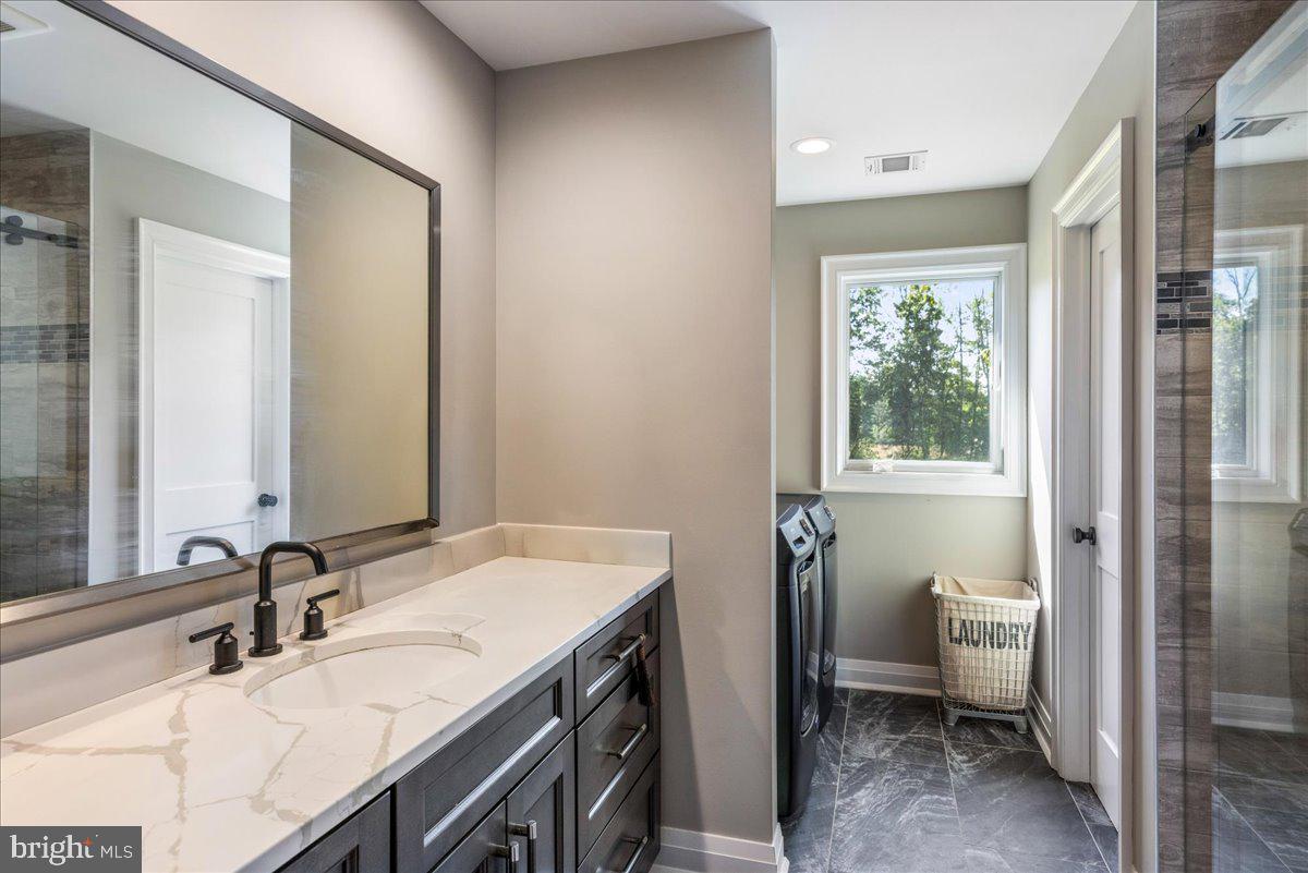 29 Tumble Falls Road Stockton, NJ 08559 - Photo 61 of 78 a bathroom with a sink and a mirror