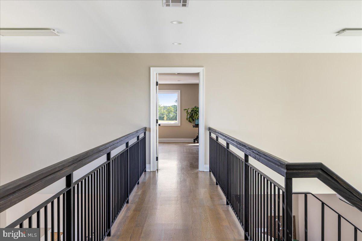 29 Tumble Falls Road Stockton, NJ 08559 - Photo 63 of 78 a view of a hallway with wooden floor