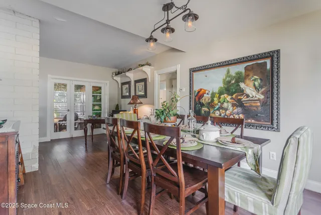 a view of a dining room with furniture and window