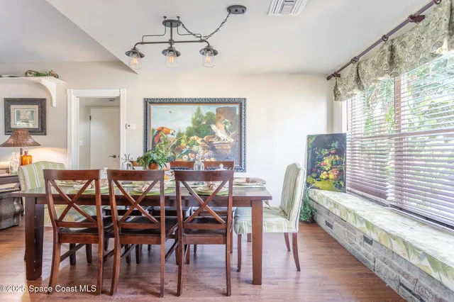 a view of chair and table in the room