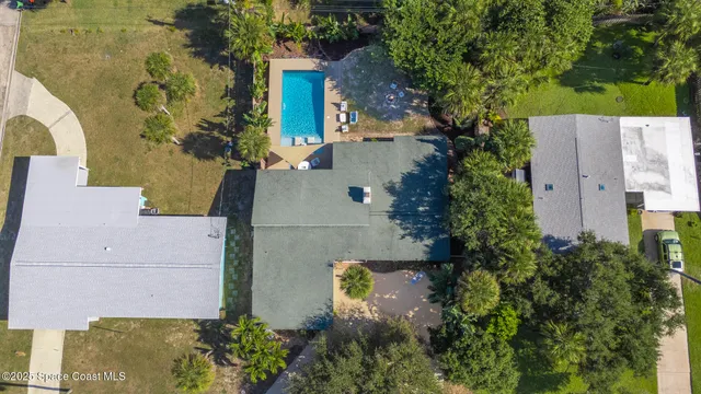 a front view of a house with yard porch and furniture