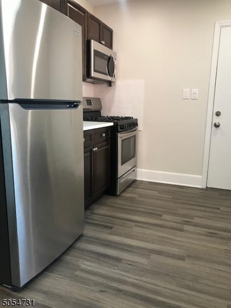 3 William Street, Unit 2 Montclair, NJ 07042 - Photo 11 of 21 a kitchen with stainless steel appliances a refrigerator sink and microwave