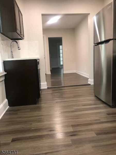 3 William Street, Unit 2 Montclair, NJ 07042 - Photo 15 of 21 an empty room with wooden floor and cabinet