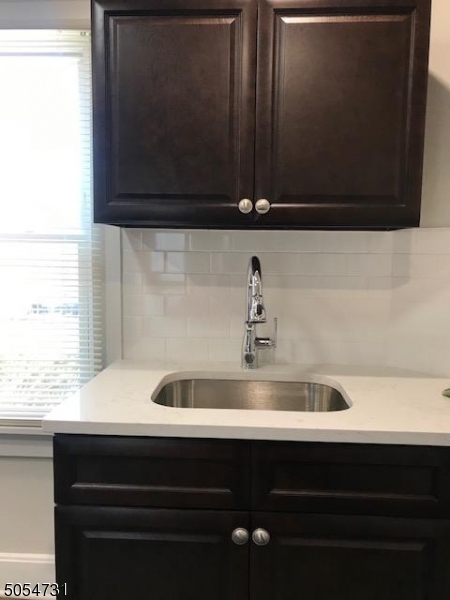 3 William Street, Unit 2 Montclair, NJ 07042 - Photo 17 of 21 a bathroom with a sink and a mirror