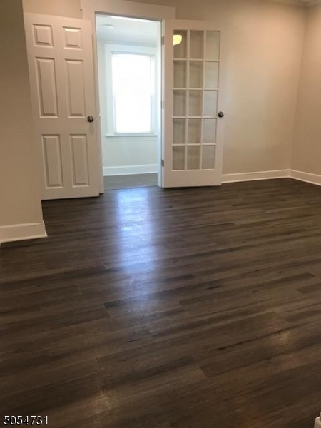 3 William Street, Unit 2 Montclair, NJ 07042 - Photo 4 of 21 an empty room with wooden floor and windows