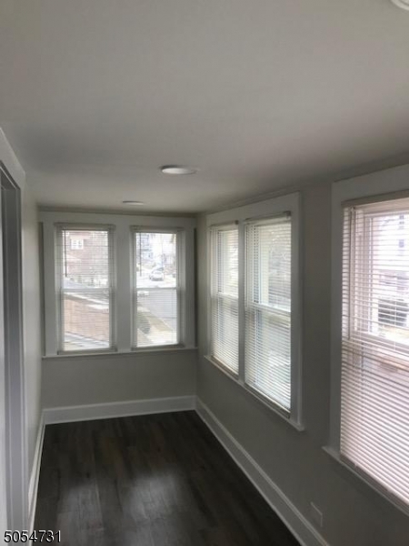 3 William Street, Unit 2 Montclair, NJ 07042 - Photo 6 of 21 a view of an empty room with wooden floor and a window