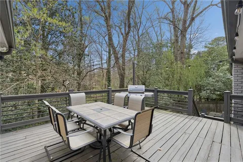 a view of outdoor sitting area with furniture on wooden deck