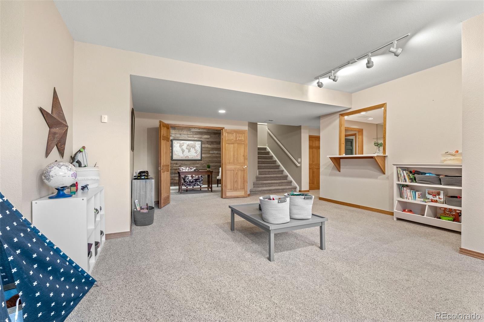 1735 Prima Lane Evergreen, CO 80439 - Photo 34 of 50 a living room with furniture a piano and a window