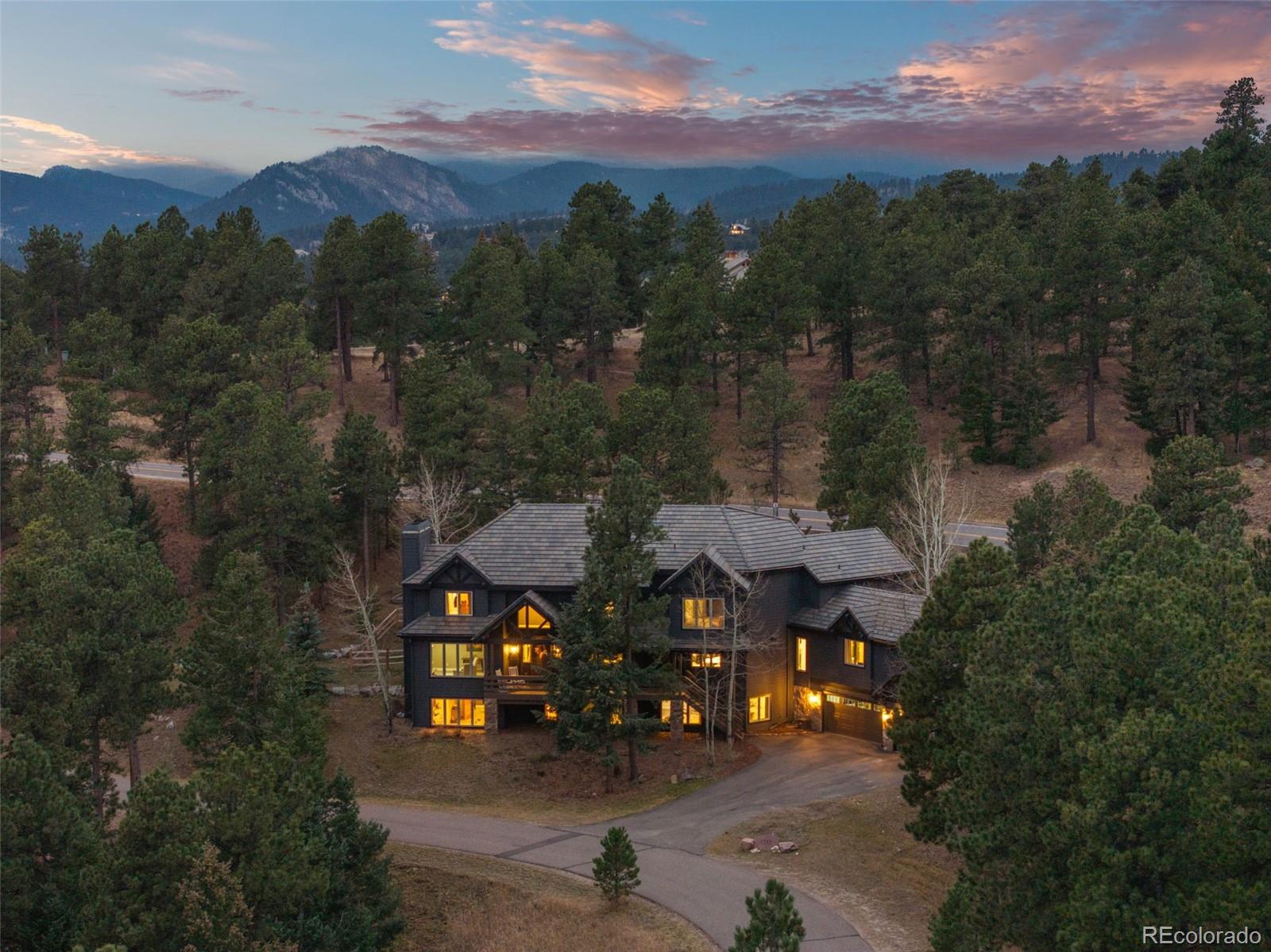 1735 Prima Lane Evergreen, CO 80439 - Photo 46 of 50 an aerial view of a house with a yard
