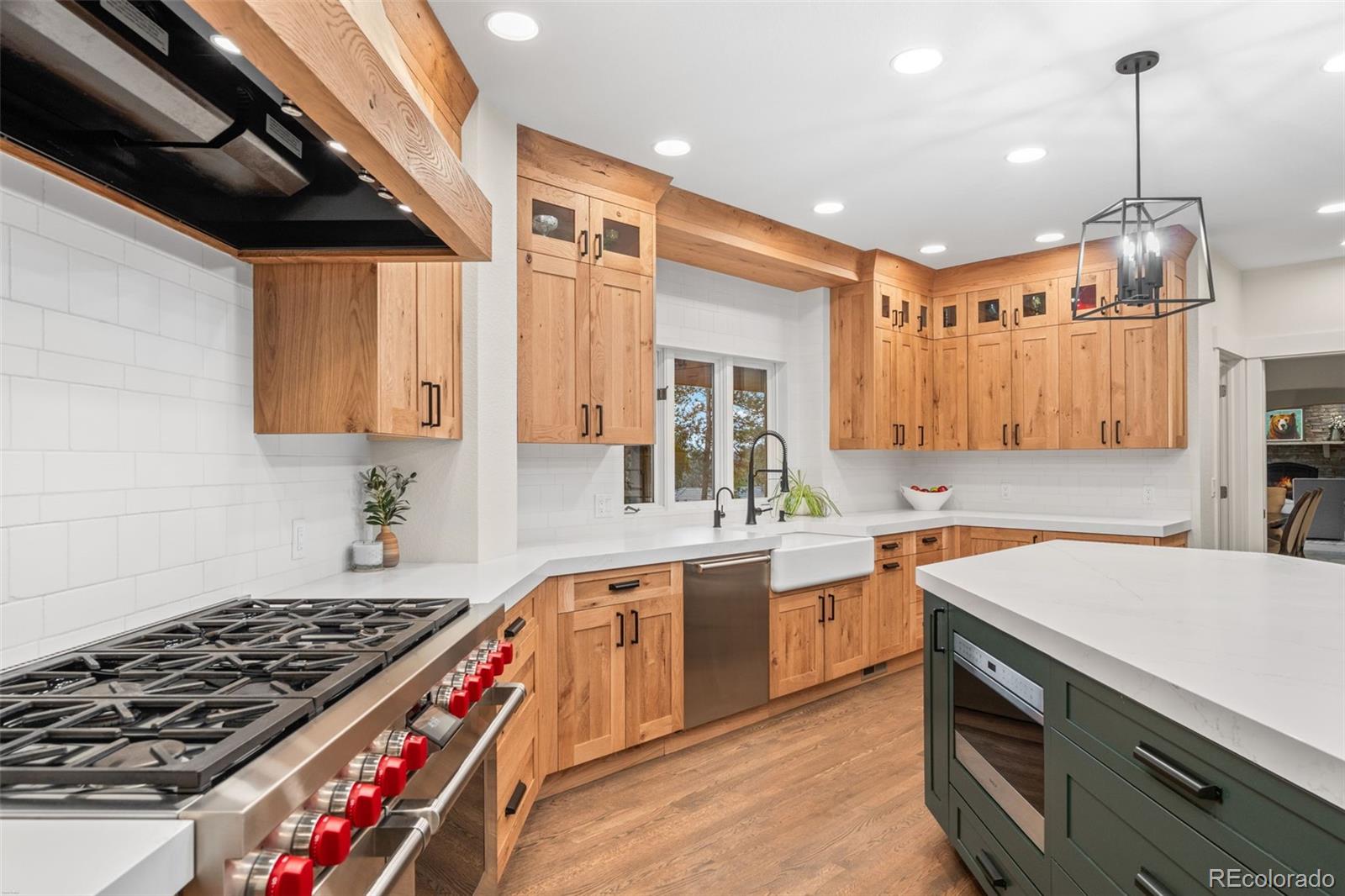 1735 Prima Lane Evergreen, CO 80439 - Photo 10 of 50 a kitchen with a stove and a sink