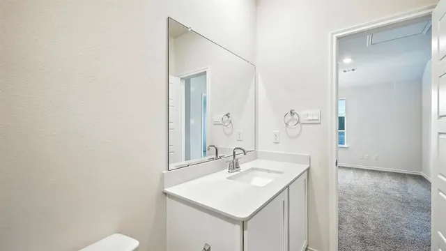 a view of closet area with empty racks