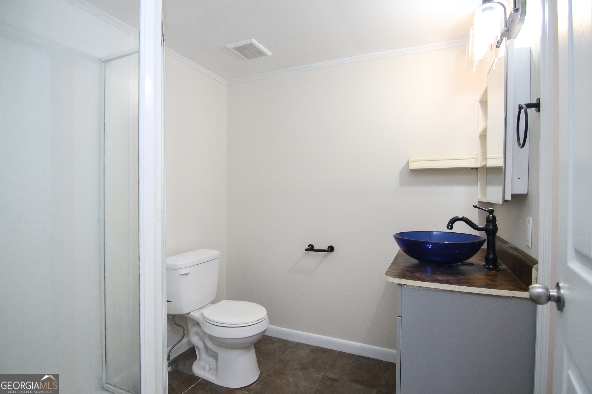 48 Forest Avenue Butler, GA 31006 - Photo 12 of 21 a bathroom with a toilet and a shower