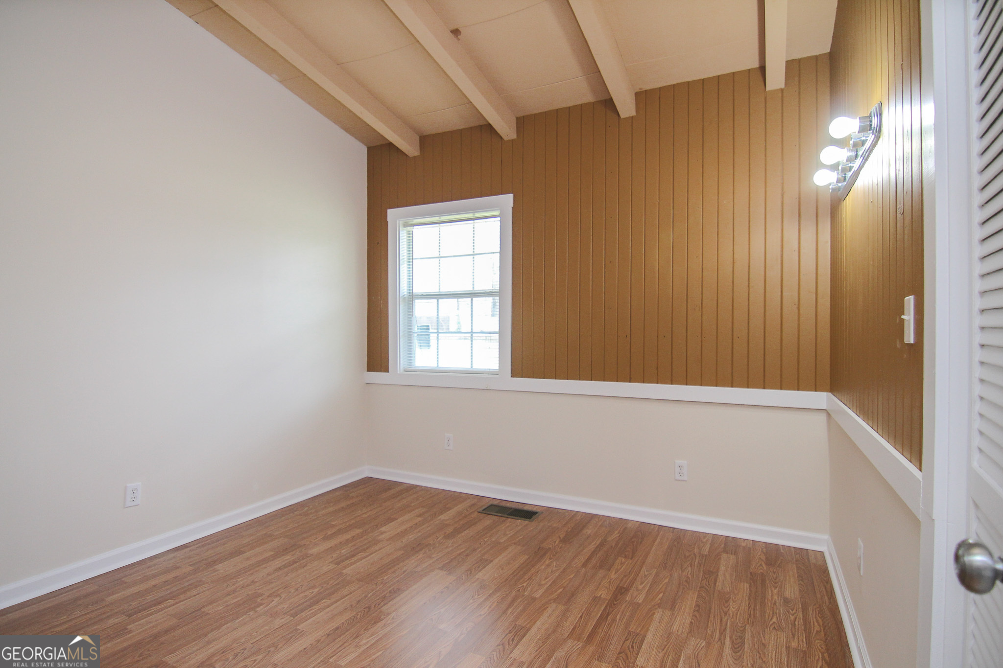 48 Forest Avenue Butler, GA 31006 - Photo 13 of 21 an empty room with wooden floor and windows