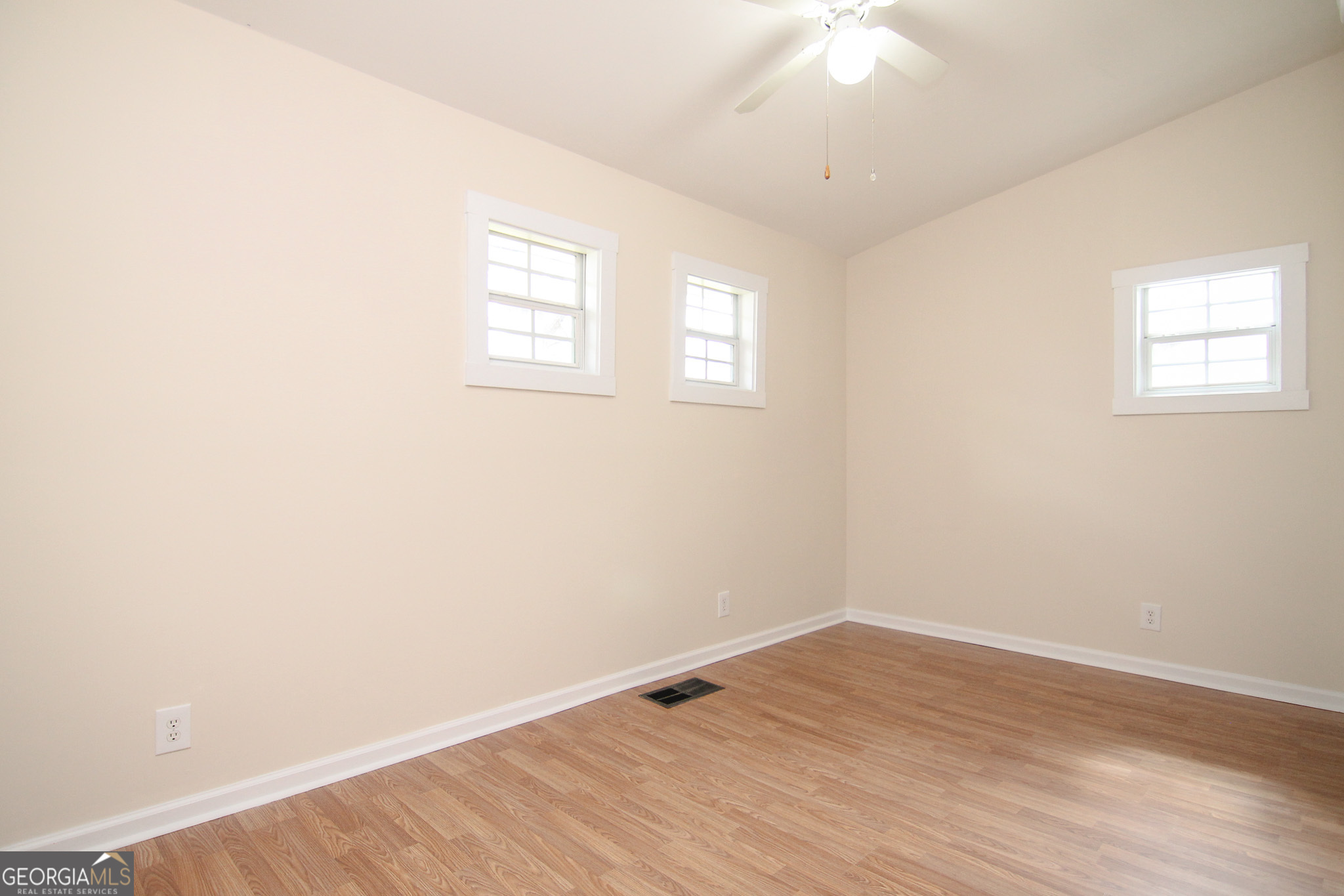 48 Forest Avenue Butler, GA 31006 - Photo 15 of 21 an empty room with wooden floor and windows