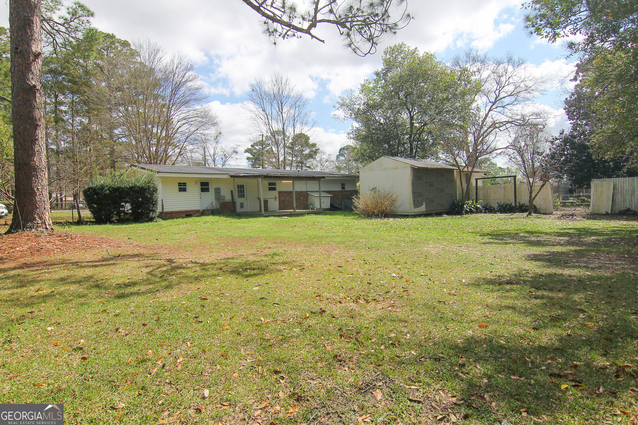 48 Forest Avenue Butler, GA 31006 - Photo 20 of 21 a view of a house with a yard and trees