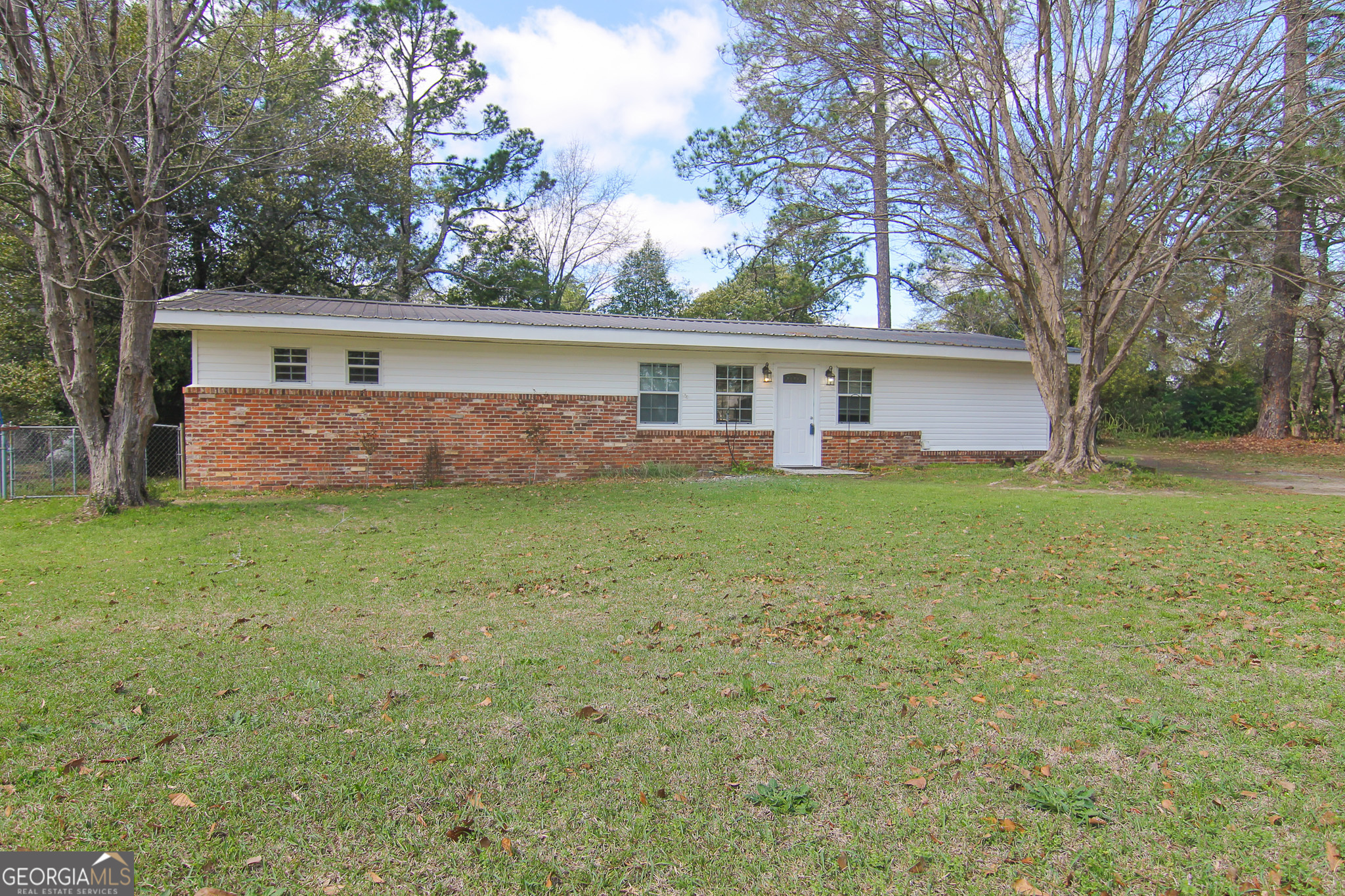 48 Forest Avenue Butler, GA 31006 - Photo 2 of 21 a view of a house with a yard and a tree