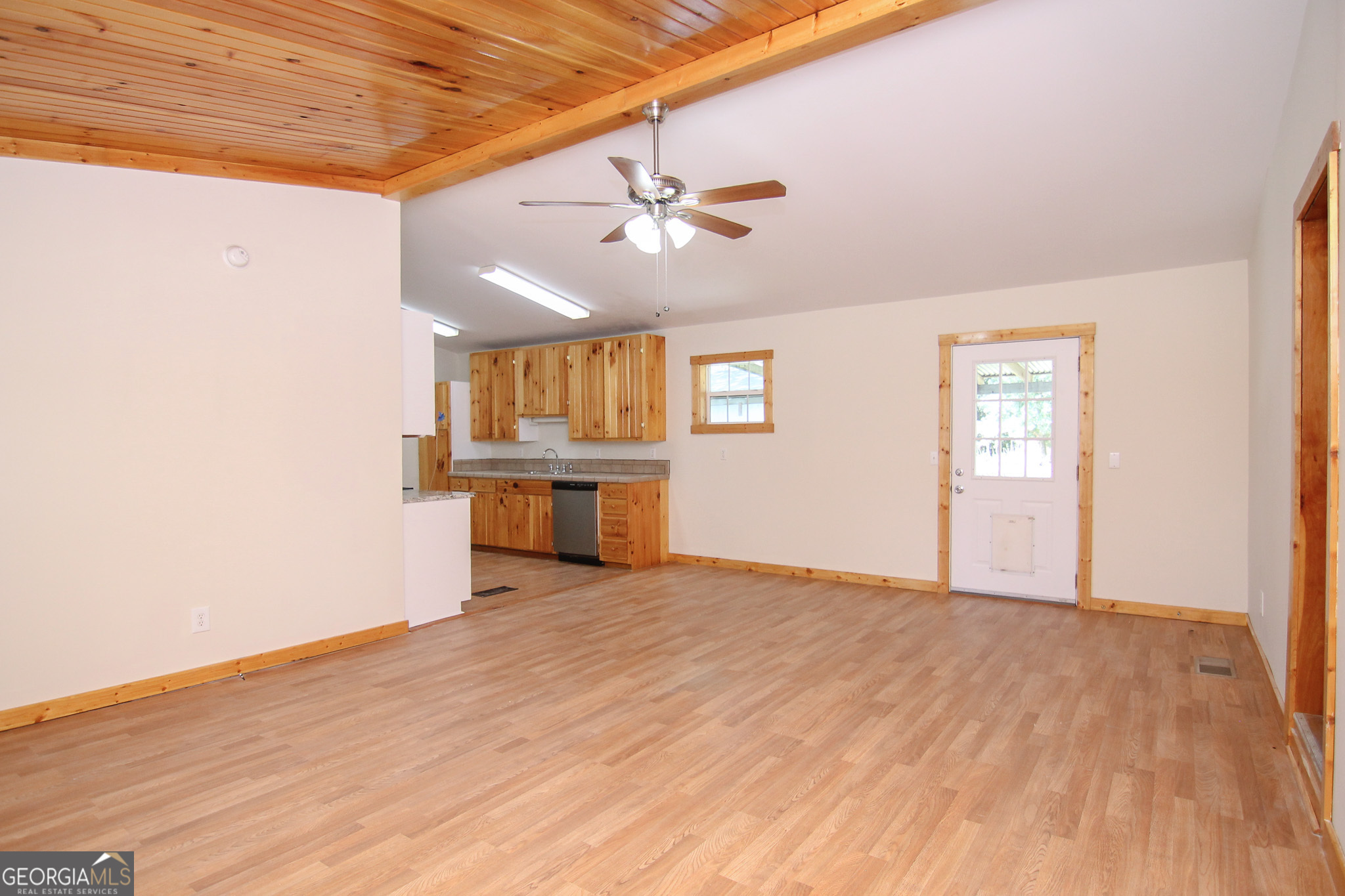 48 Forest Avenue Butler, GA 31006 - Photo 3 of 21 wooden floor in an empty room with a window
