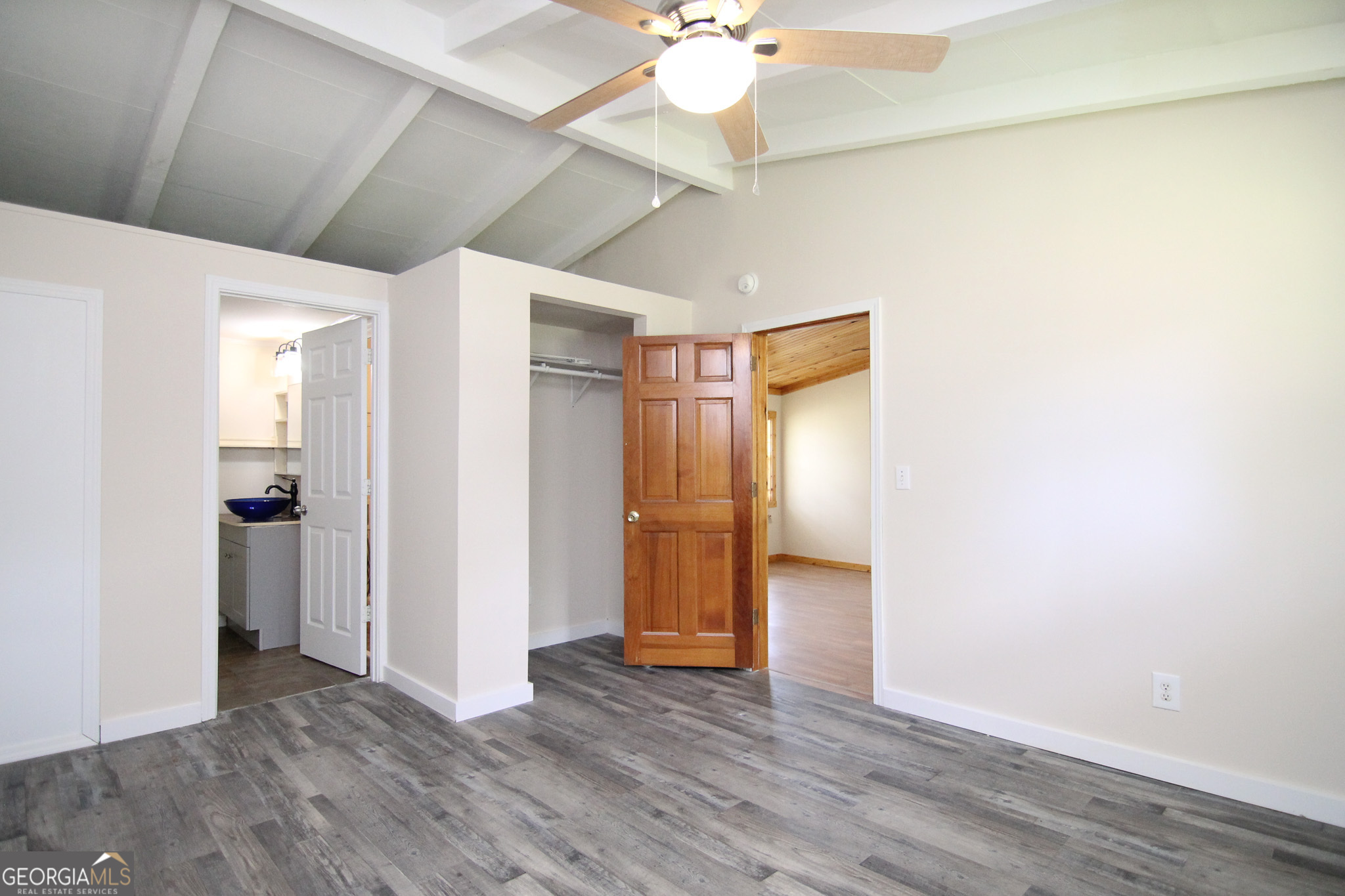 48 Forest Avenue Butler, GA 31006 - Photo 10 of 21 an empty room with wooden floor and ceiling fan