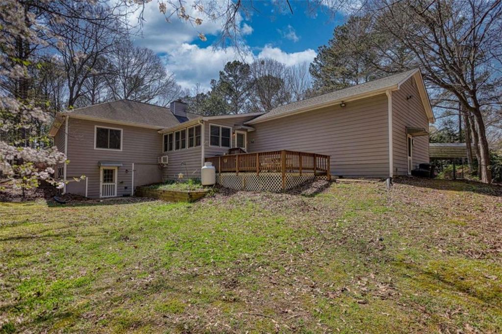 2740 Dennard Road Northeast Conyers, GA 30013 - Photo 44 of 51 a backyard of a house with table and chairs