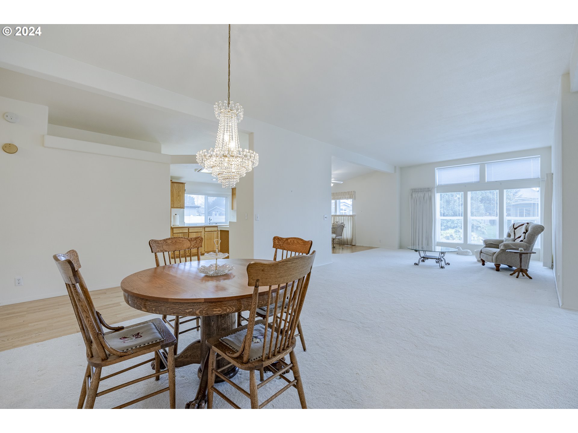 3220 Crescent Avenue, Unit 67 Eugene, OR 97408 - Photo 14 of 48 a dining room with furniture and a chandelier