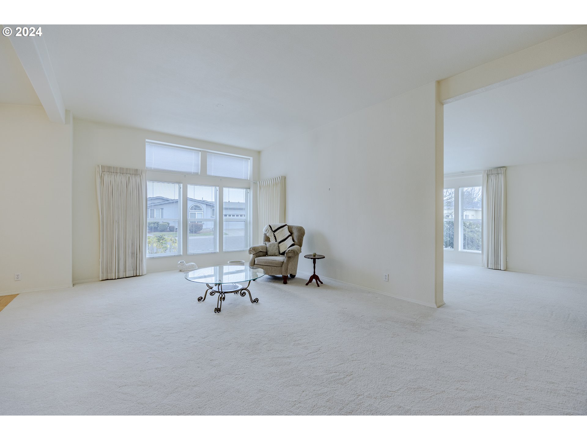 3220 Crescent Avenue, Unit 67 Eugene, OR 97408 - Photo 16 of 48 a living room with furniture and a large window