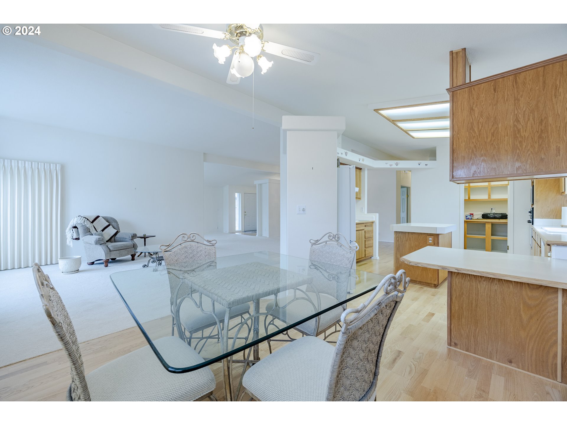 3220 Crescent Avenue, Unit 67 Eugene, OR 97408 - Photo 23 of 48 a living room with furniture and a chandelier