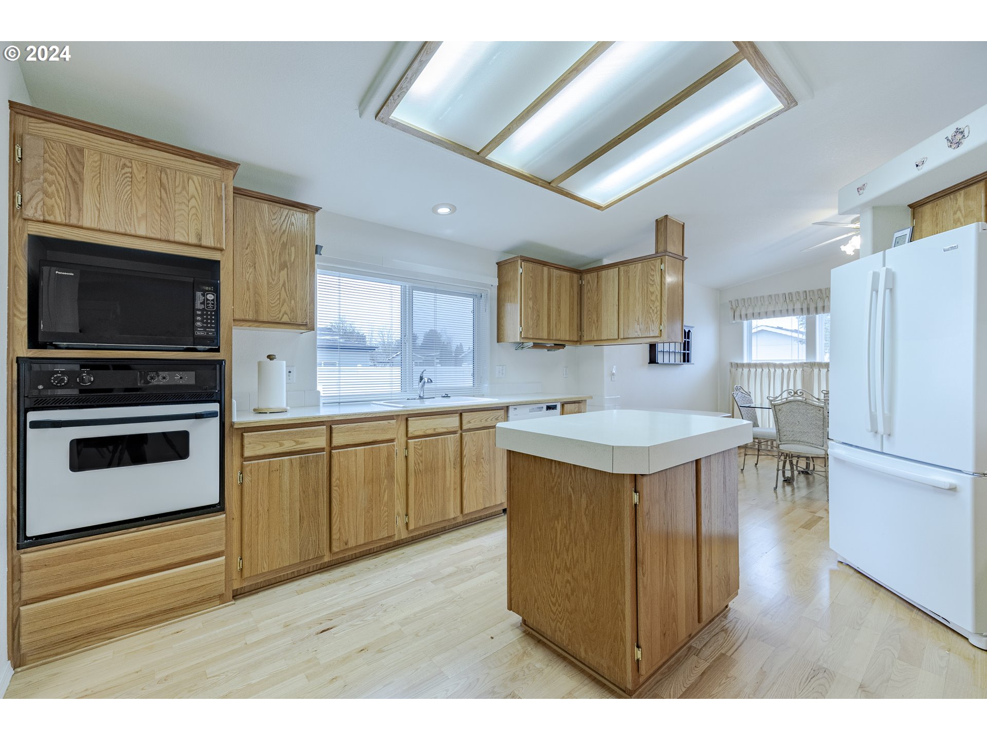 3220 Crescent Avenue, Unit 67 Eugene, OR 97408 - Photo 30 of 48 a kitchen with a sink appliances and cabinets