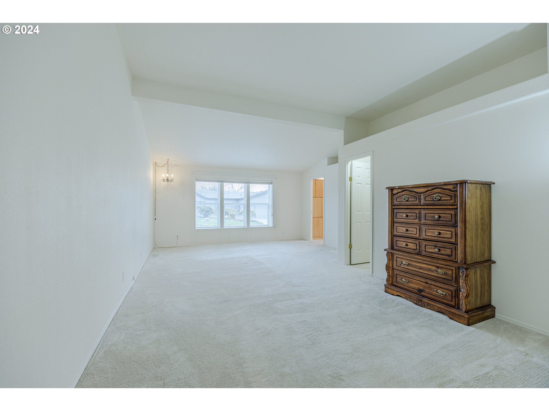 3220 Crescent Avenue, Unit 67 Eugene, OR 97408 - Photo 34 of 48 a view of an empty room with a window