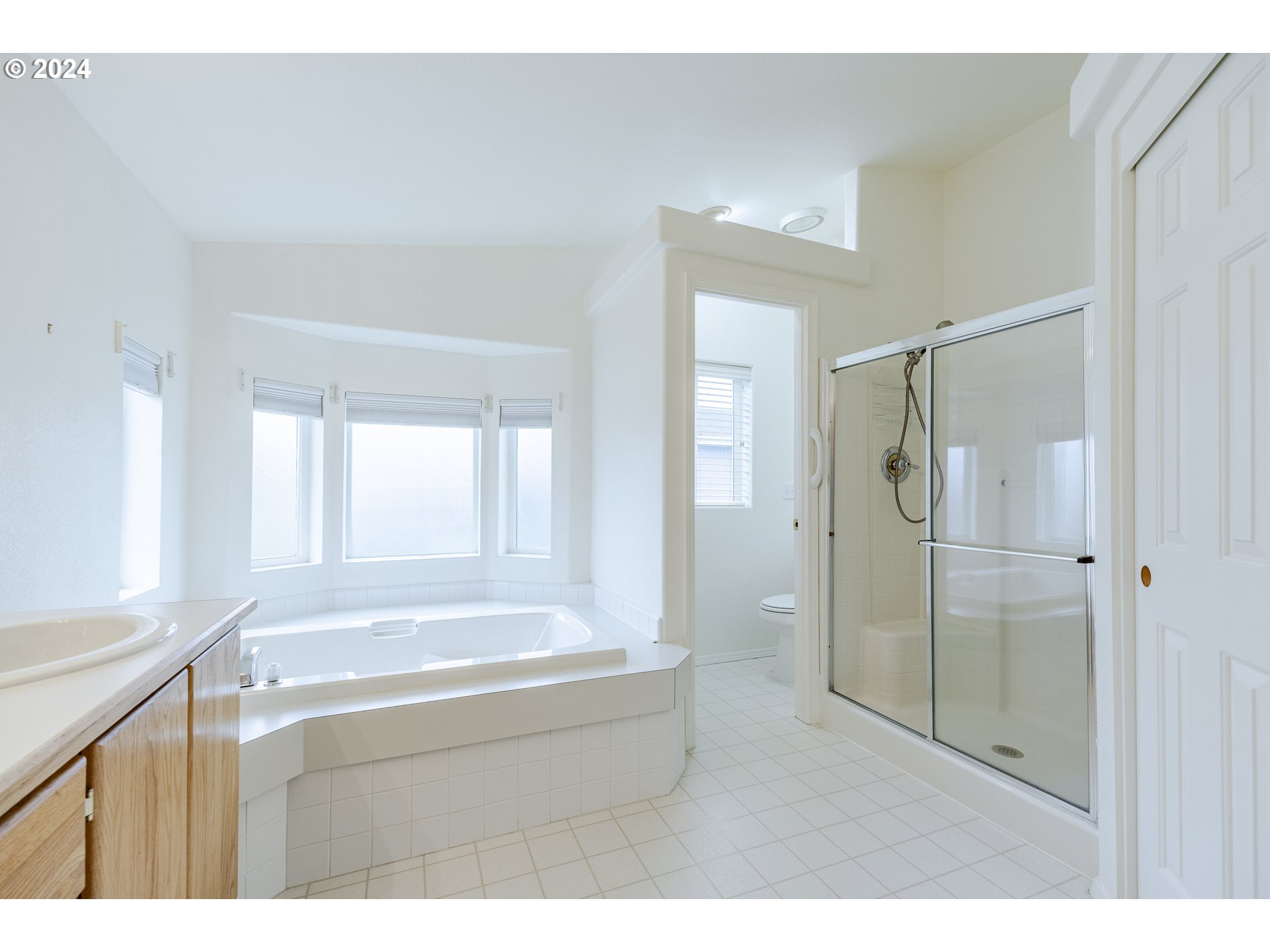 3220 Crescent Avenue, Unit 67 Eugene, OR 97408 - Photo 39 of 48 a bathroom with a tub shower and sink
