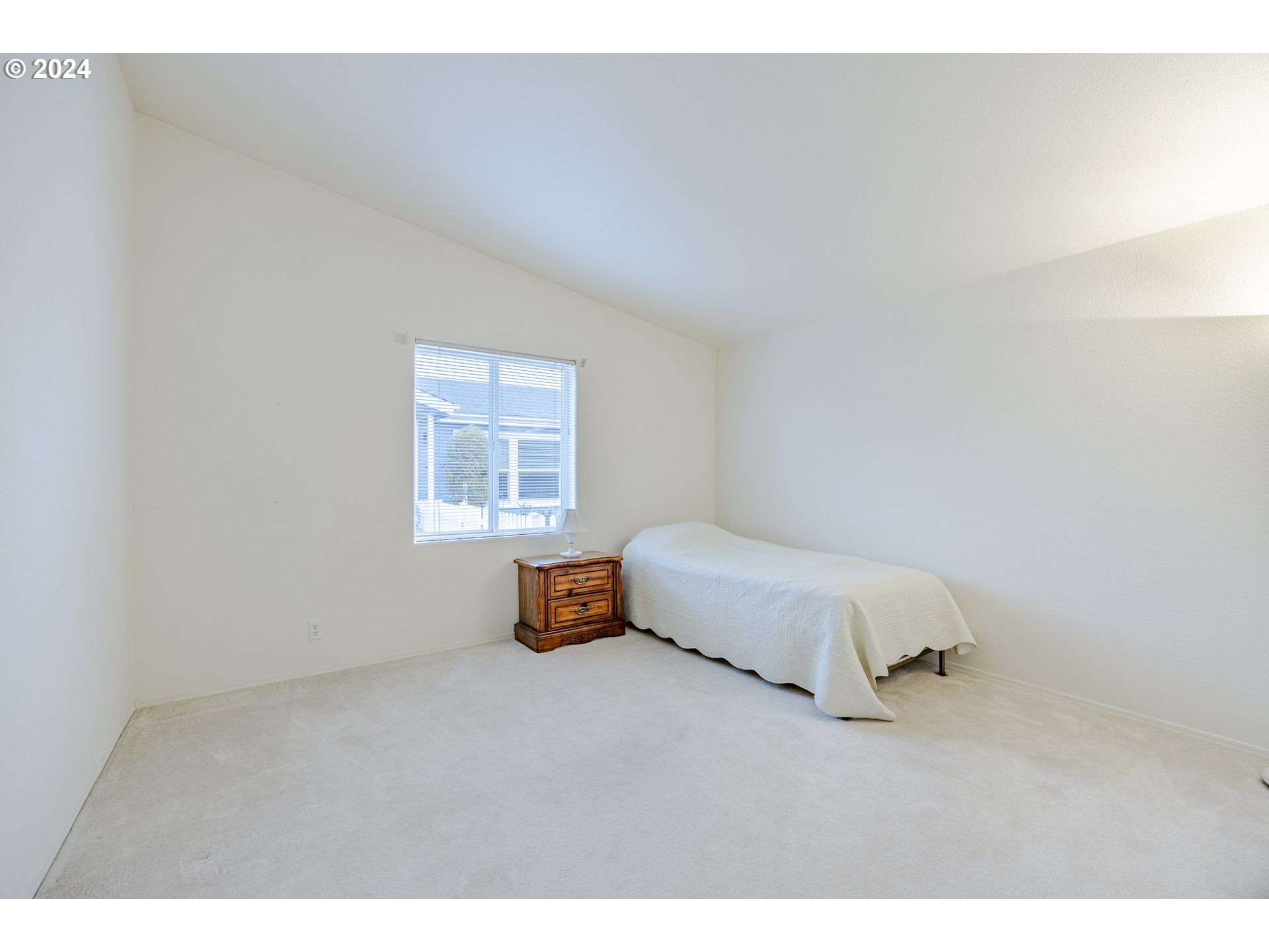 3220 Crescent Avenue, Unit 67 Eugene, OR 97408 - Photo 42 of 48 a bedroom with a bed and a window