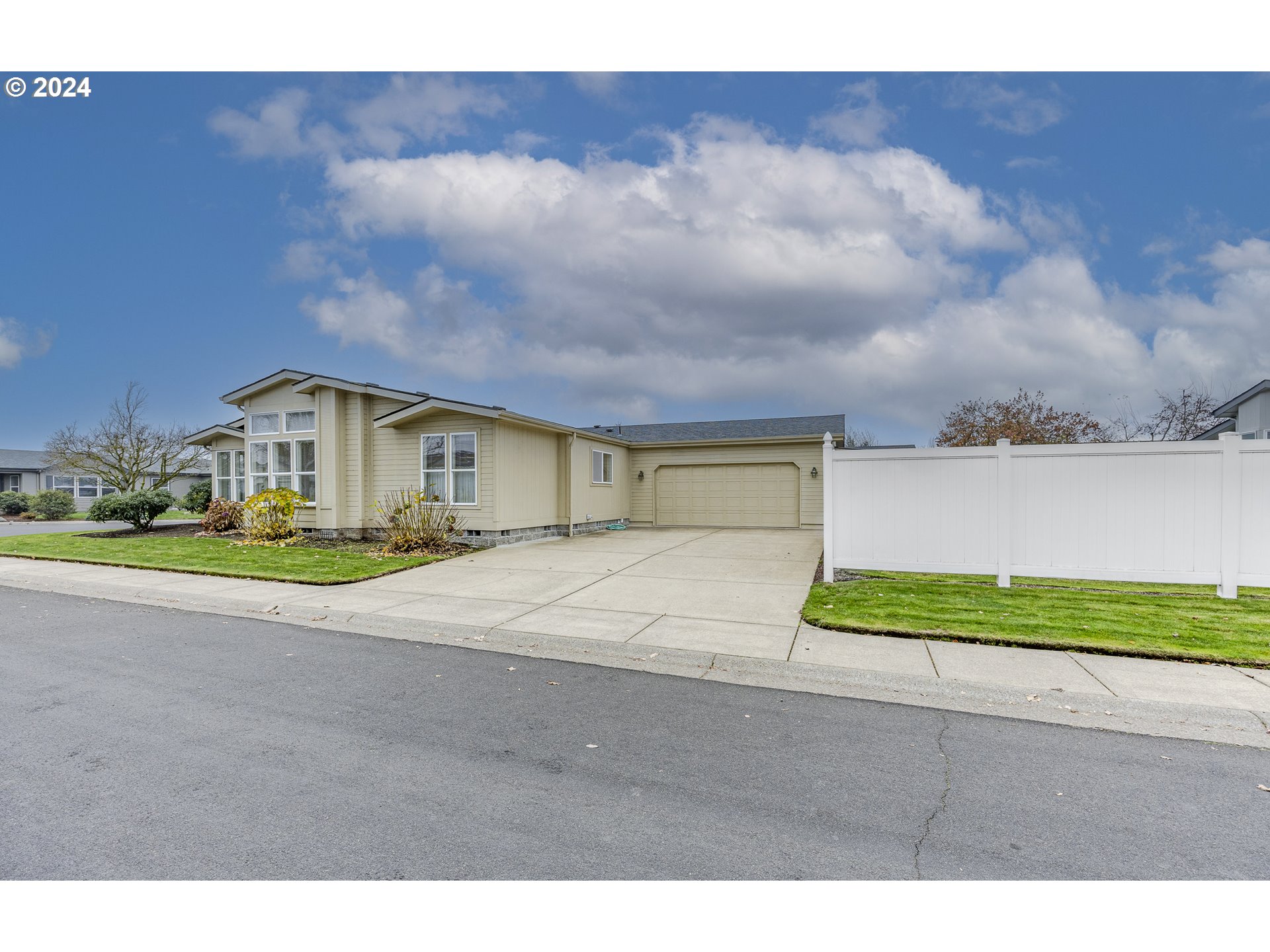 3220 Crescent Avenue, Unit 67 Eugene, OR 97408 - Photo 46 of 48 a house with trees in the background