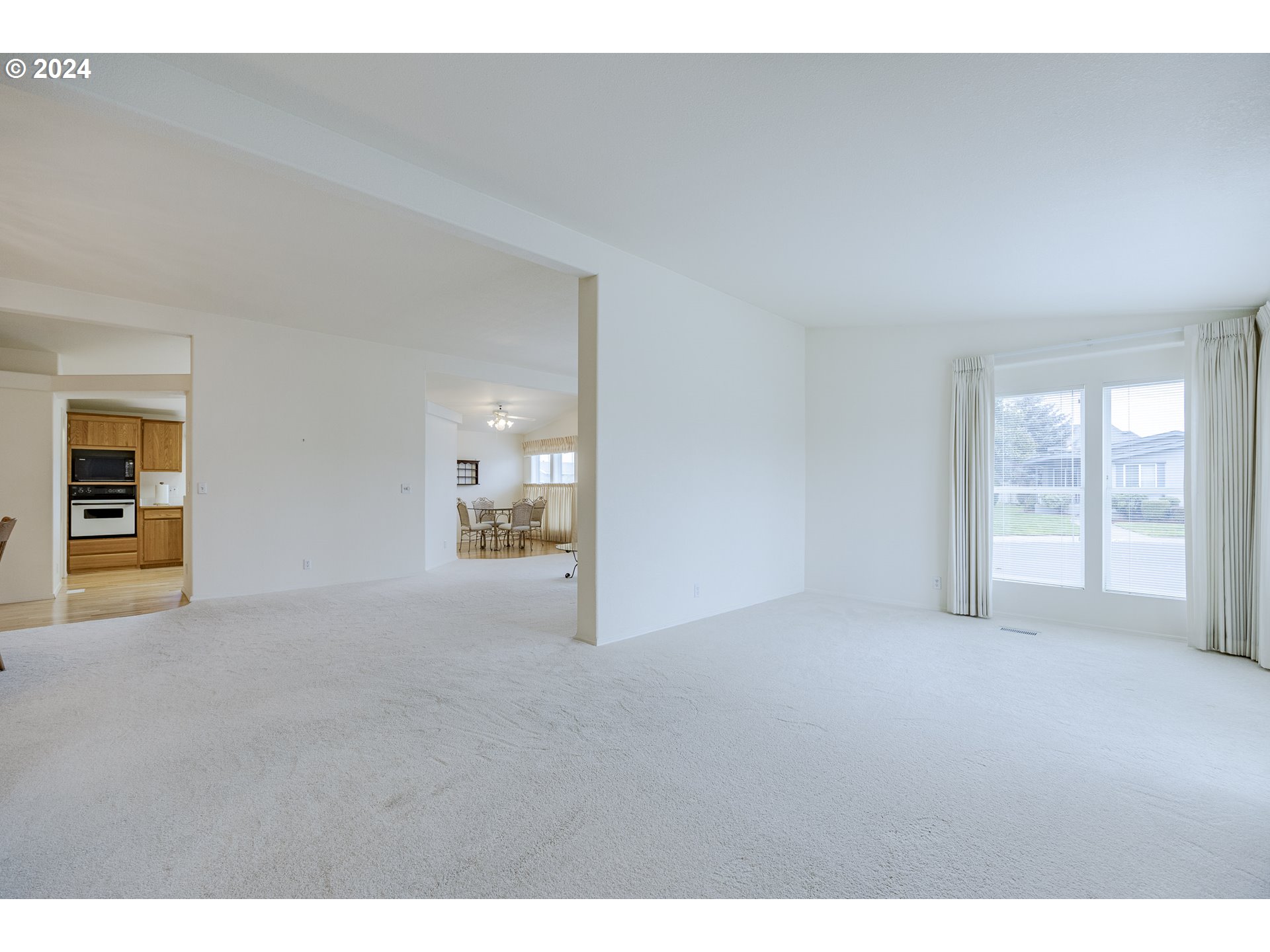 3220 Crescent Avenue, Unit 67 Eugene, OR 97408 - Photo 7 of 48 a view of an empty room with a window