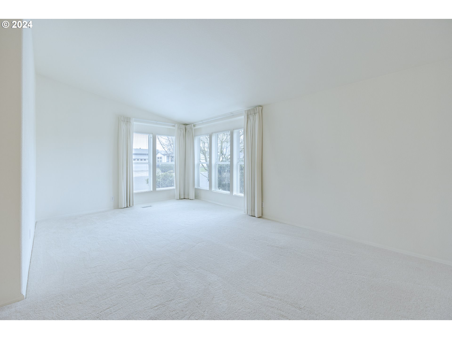 3220 Crescent Avenue, Unit 67 Eugene, OR 97408 - Photo 10 of 48 a view of an empty room with a window