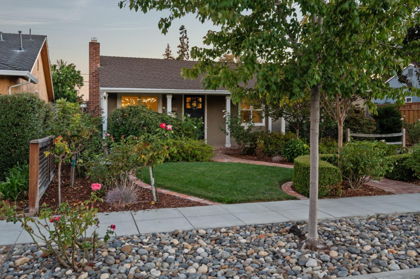 2428 Tulip Road San Jose, CA 95128 - Photo 1 of 59 a front view of a house with a garden