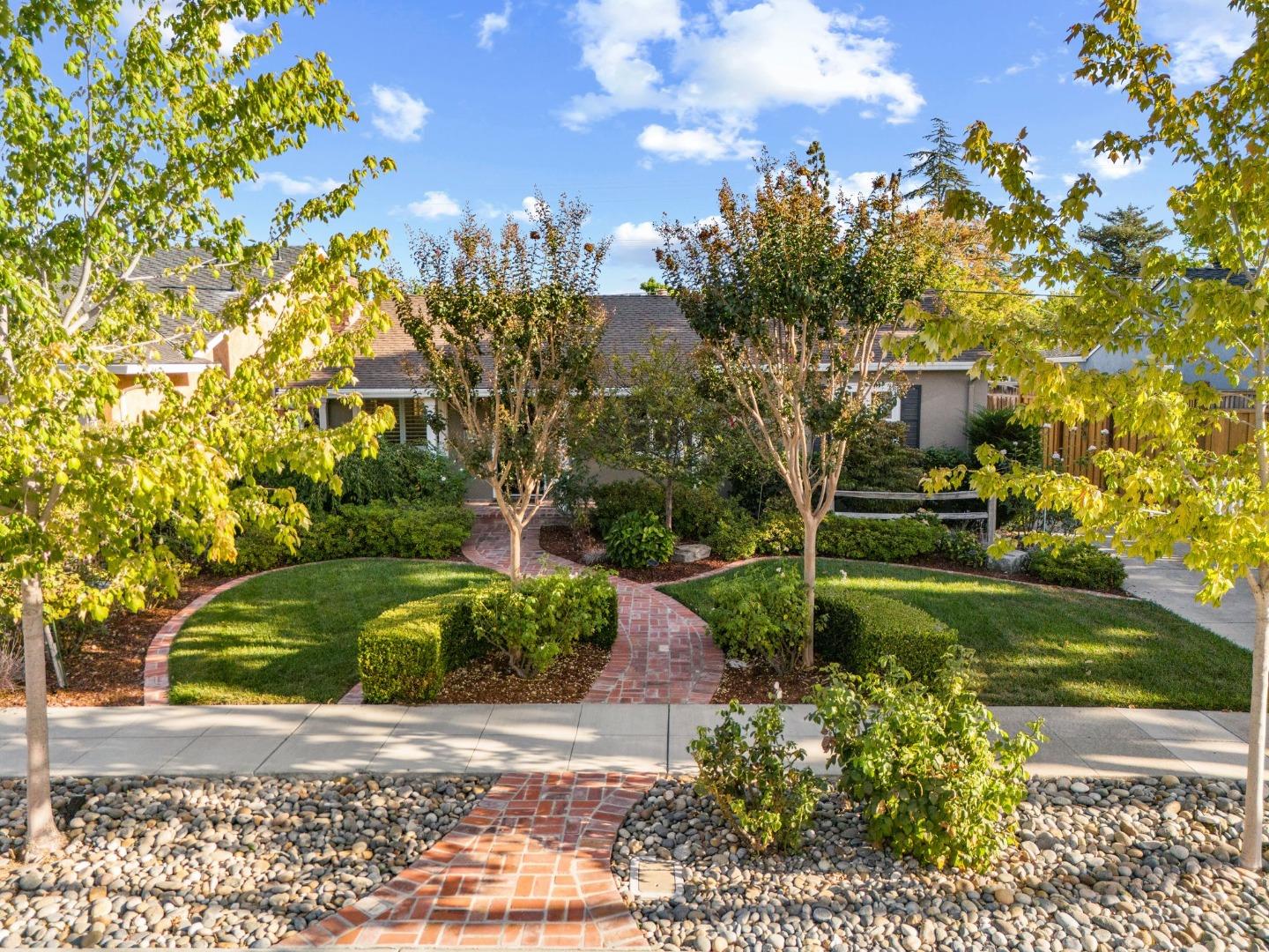 2428 Tulip Road San Jose, CA 95128 - Photo 12 of 59 a front view of a house with garden